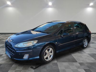a picture of a blue car parked in a garage