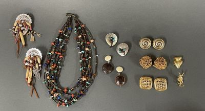 a lot of jewelry that is laying out on the table