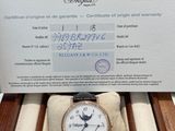 a box with a watch inside of it on a table