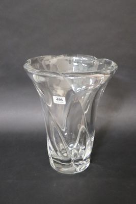 a glass vase that is sitting on a table