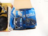 a box of fishing reels and a reel on a table