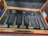 a suitcase with tools in it sitting on a table