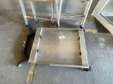 two ladders sitting next to each other on the floor