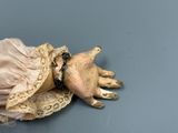 a doll that is laying down on a table