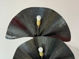 two lamps that are sitting on top of each other
