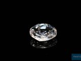 a close up of a diamond on a black surface
