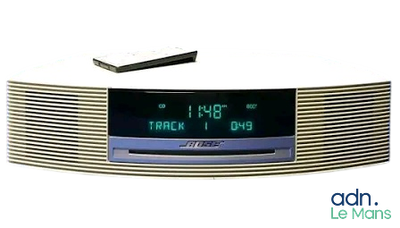 a clock that is sitting on top of a radio