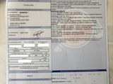 a picture of a car registration form on a table