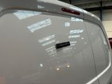 a close up of a white van with a sticker on it