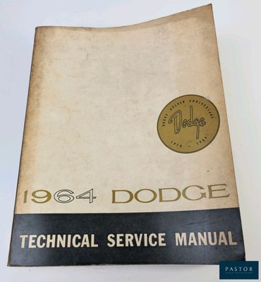 a close up of a book on a table with a clock on it
