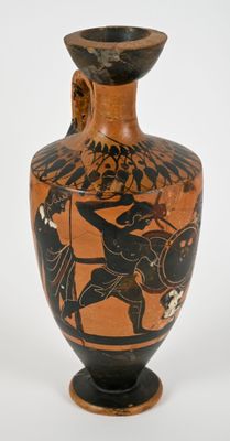 a vase with a painting of a man on a horse