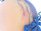 a vase that has a blue flower on top of it