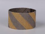 grey and yellow striped bracelet with a metal clasp