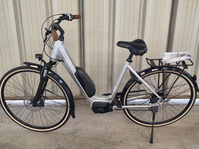 a bike that is parked in front of a building