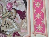 a picture of a wall hanging with a bunch of flowers on it