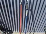 two skis that are leaning up against a wall