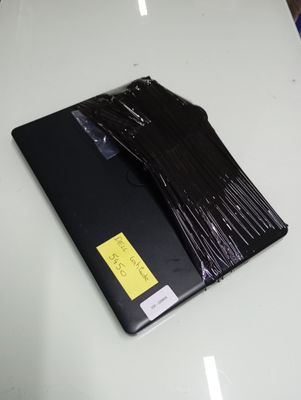 a laptop that has been wrapped up on a table