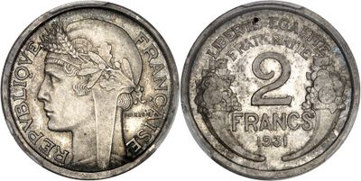 a close up of a coin with the face of a woman on it