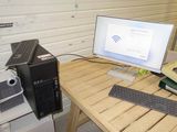 a desktop computer sitting on top of a wooden desk