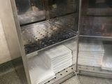 a silver refrigerator with a bunch of plates inside of it