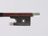 a close up of a violin bow on a white background