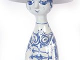 a blue and white figurine with a hat on it