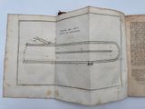 an open book with a drawing of a train on it