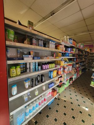 many shelves in the store that have various products on them