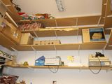 a room with a lot of shelves that have items on them