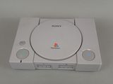 the sony playstation classic console is sitting on a white surface