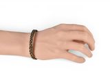 brown braided leather bracelet on a mannequin hand