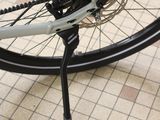 a close up of a bicycle wheel on a tiled floor