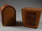 a small wooden box with a door and a small wooden box with a door
