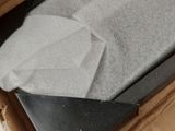 a box that has a piece of cloth in it