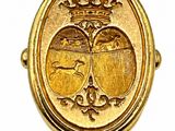 an image of a gold locke with a picture of two birds and a crown on it