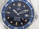 a close up of a watch on a white surface