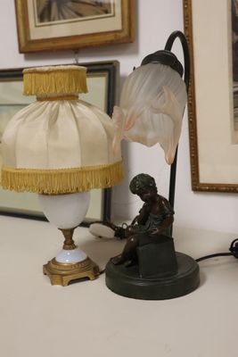 a lamp that is sitting on a table next to a lamp shade