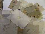 a pile of envelopes that are sitting on a table