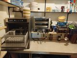 a kitchen counter with a lot of dishes and dishes on it