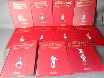 six red books with figurines of soldiers on them sitting on a table