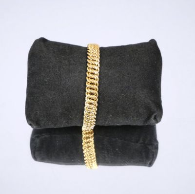 a black velvet bag with a gold chain on it