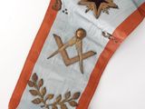 an image of a close up of a masonic sash with a star on it