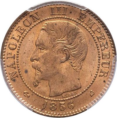 gros plan d'une pièce de monnaie sur laquelle figure un visage de femme