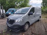 a grey van that is parked in a lot