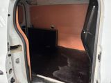 a white van with a flat screen tv inside of it