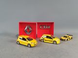 three toy cars are in a red box with a logo on it