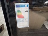 an energy label on the glass of a refrigerator door