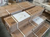many boxes stacked on top of each other in a warehouse
