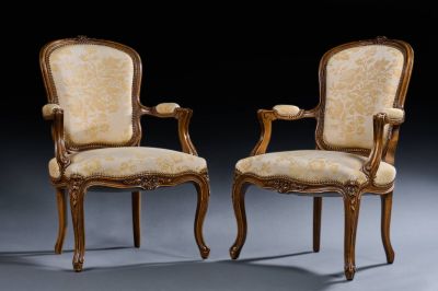 pair of louis xv style carved wood armchairs