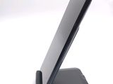 a cell phone that is sitting on top of a stand